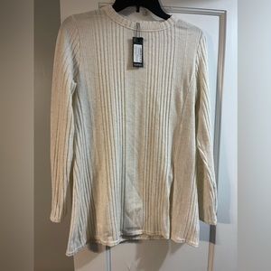 Cream colored light sweater w/ slit